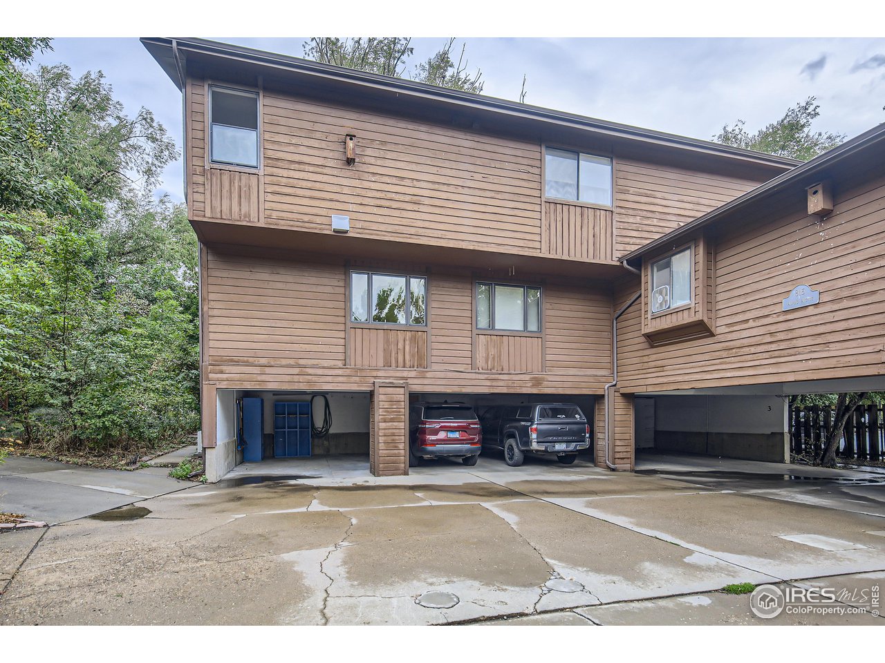 815 Alpine Avenue, Unit 4 Boulder, CO 80304 - Photo 25 of 27 a view of a house with a yard and garage
