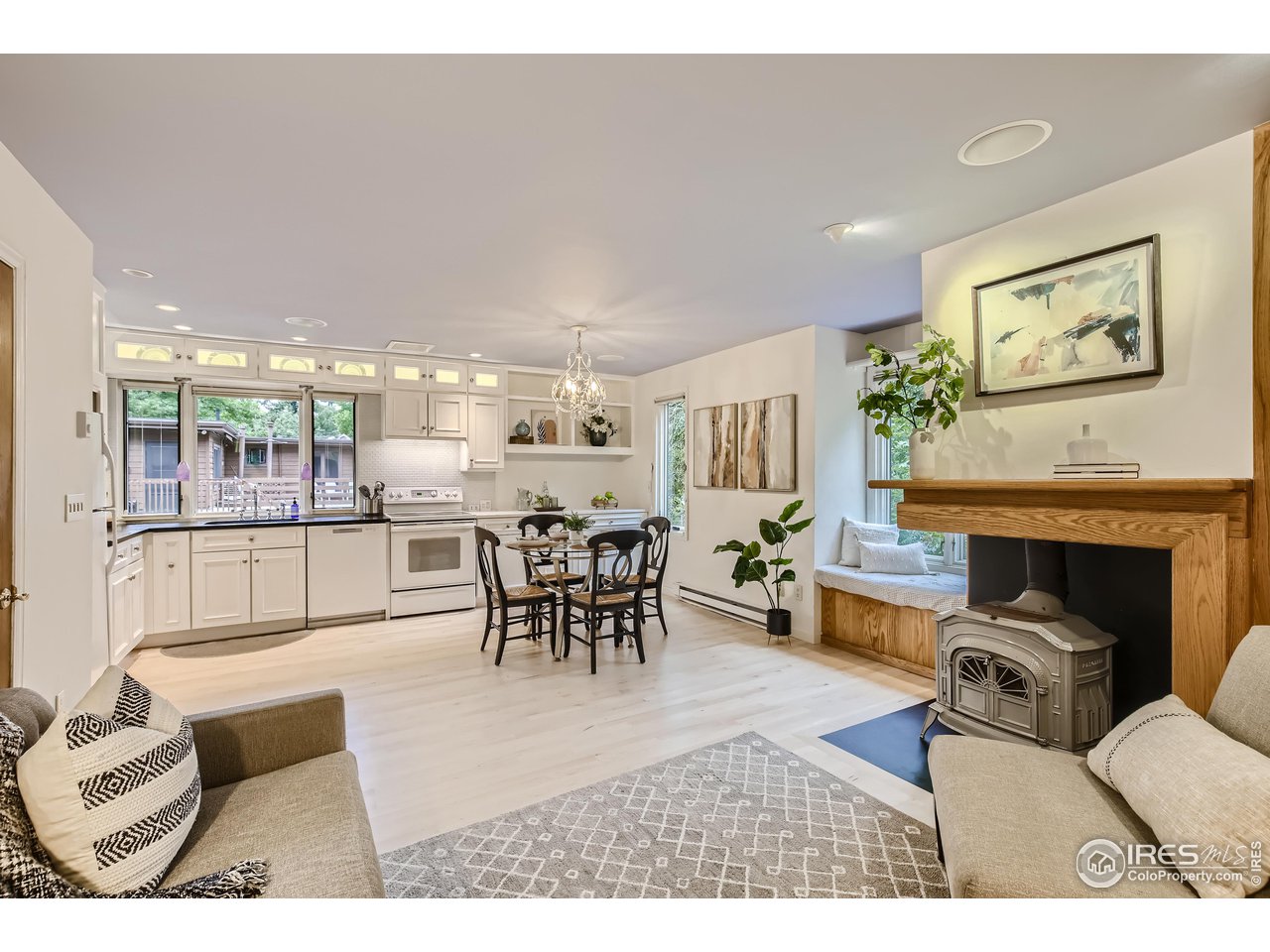 815 Alpine Avenue, Unit 4 Boulder, CO 80304 - Photo 3 of 27 a living room with furniture a table and kitchen view