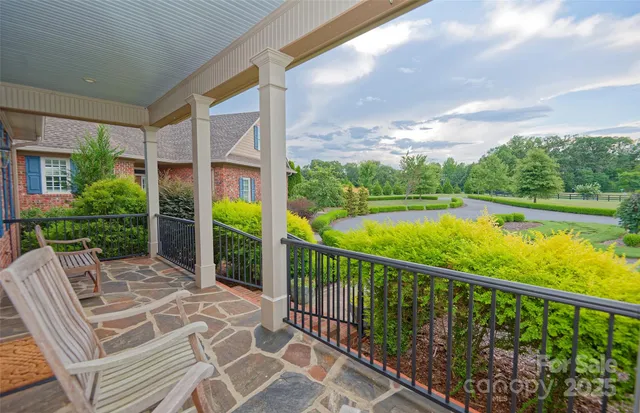 a view of balcony with furniture