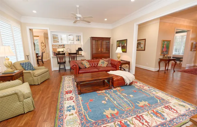 a bedroom with furniture and wooden floor