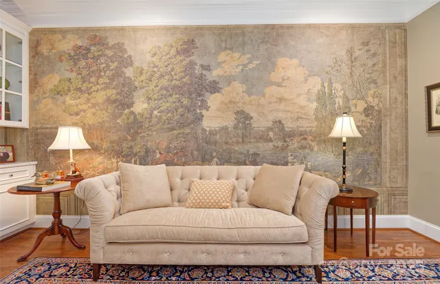 a living room with furniture and a lamp