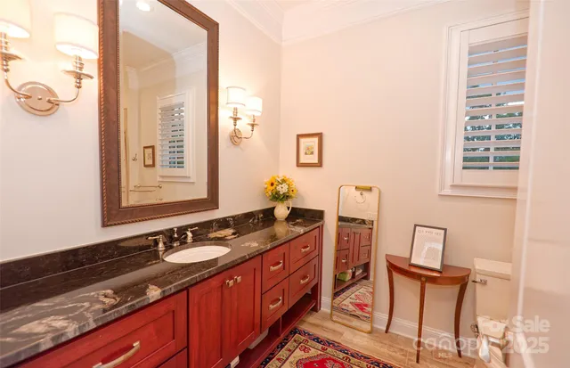 a spacious bathroom with a double vanity sink a mirror and a shower