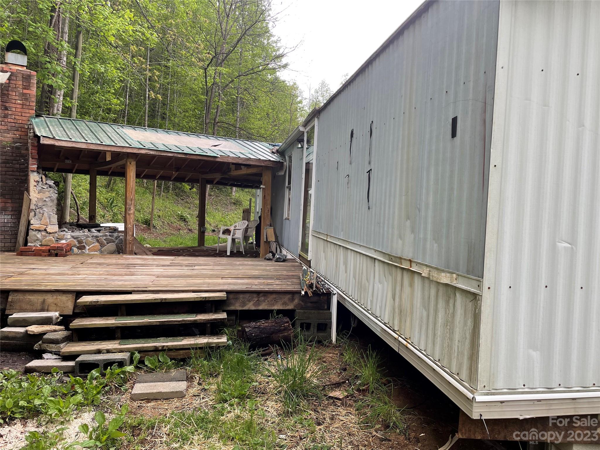 96 Sabbath Drive Old Fort, NC 28762 - Photo 15 of 25 a view of backyard with deck and outdoor seating