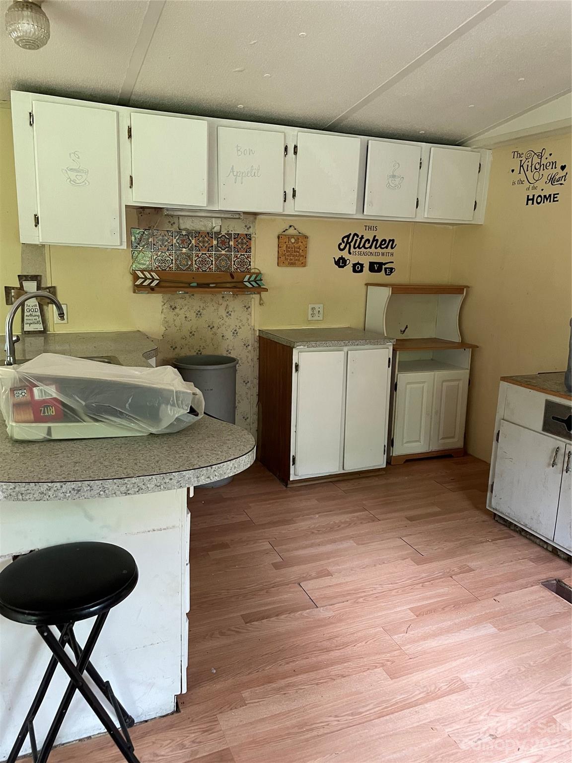 96 Sabbath Drive Old Fort, NC 28762 - Photo 19 of 25 a kitchen with a stove and a refrigerator