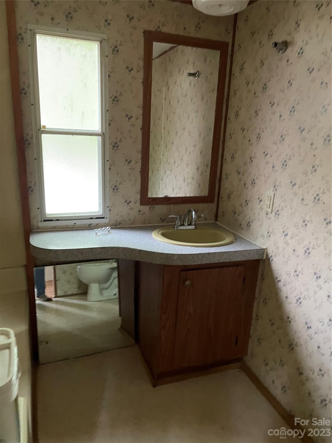 96 Sabbath Drive Old Fort, NC 28762 - Photo 20 of 25 a bathroom with a sink and a mirror