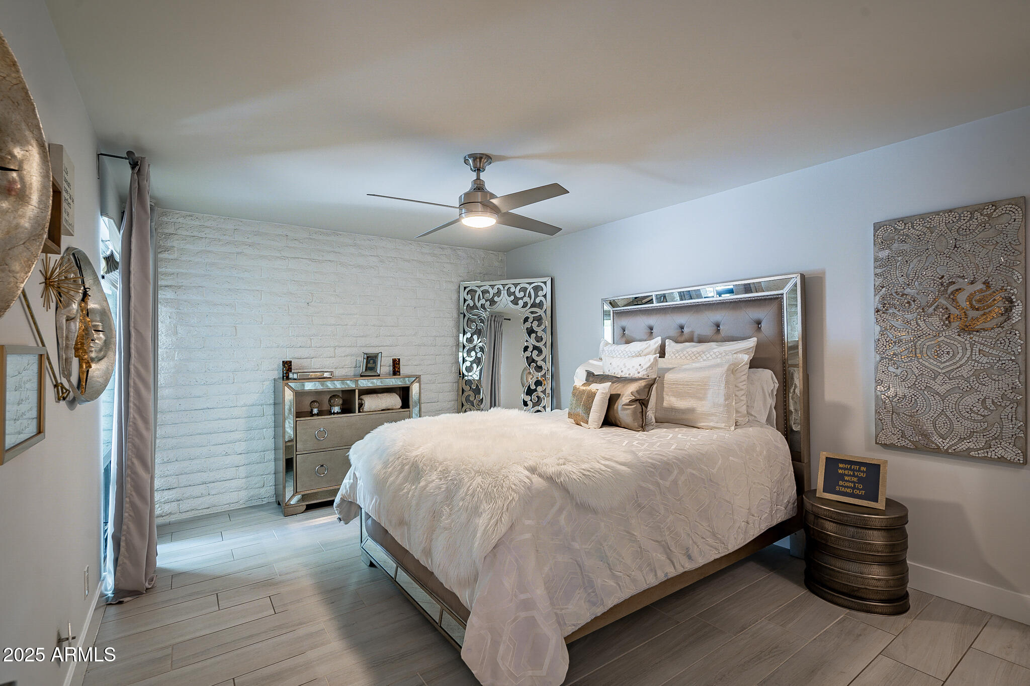 4351 North 36th Street, Unit 2 Phoenix, AZ 85018 - Photo 11 of 24 a bedroom with a bed and a ceiling fan