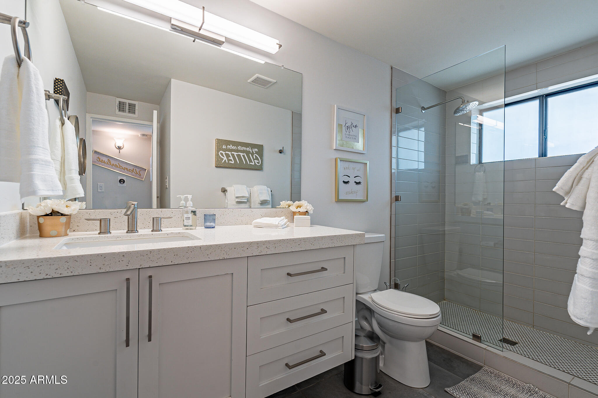 4351 North 36th Street, Unit 2 Phoenix, AZ 85018 - Photo 14 of 24 a bathroom with a toilet sink a shower and