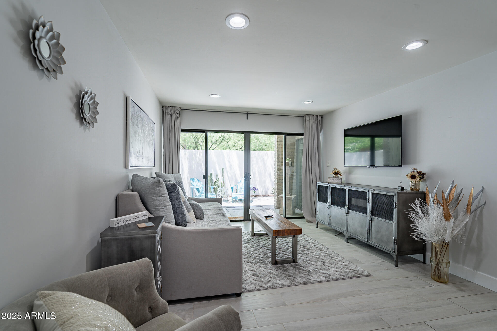 4351 North 36th Street, Unit 2 Phoenix, AZ 85018 - Photo 17 of 24 a living room with furniture and a flat screen tv