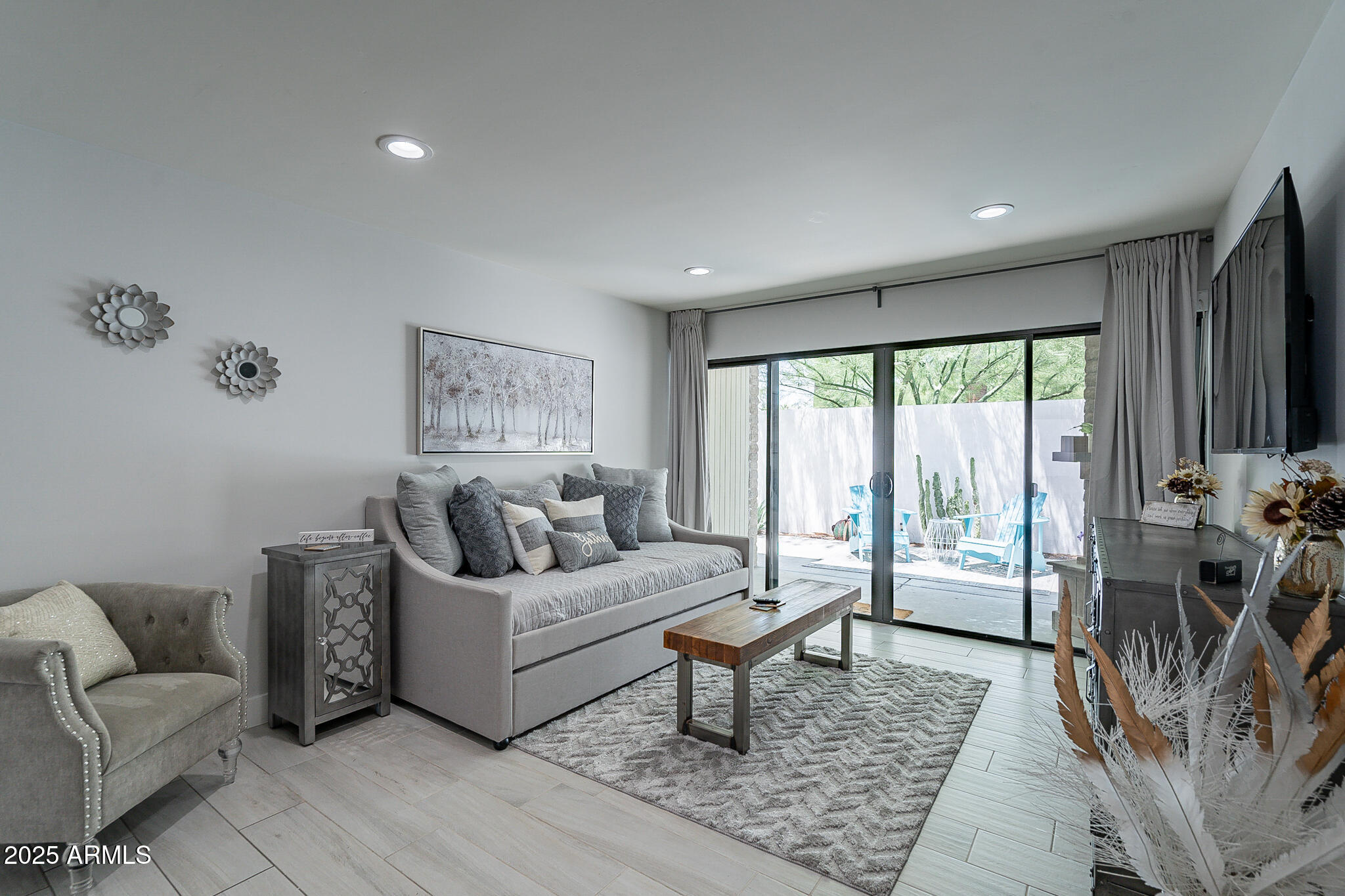 4351 North 36th Street, Unit 2 Phoenix, AZ 85018 - Photo 18 of 24 a living room with furniture and a large window
