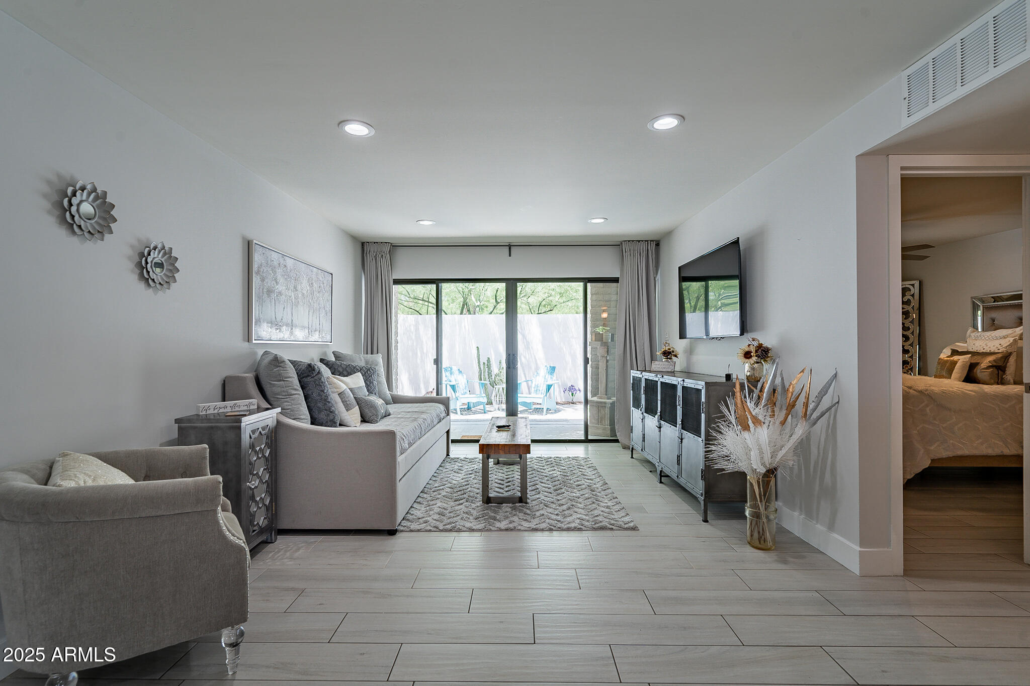 4351 North 36th Street, Unit 2 Phoenix, AZ 85018 - Photo 20 of 24 a living room with furniture and a large window