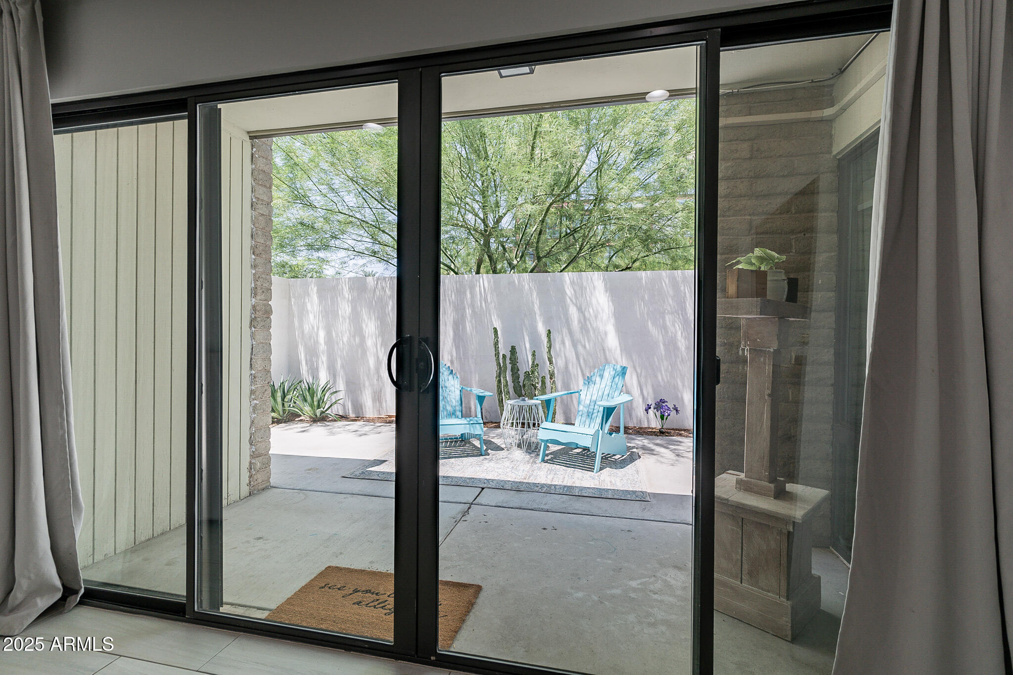 4351 North 36th Street, Unit 2 Phoenix, AZ 85018 - Photo 22 of 24 a room with a large window and a bed
