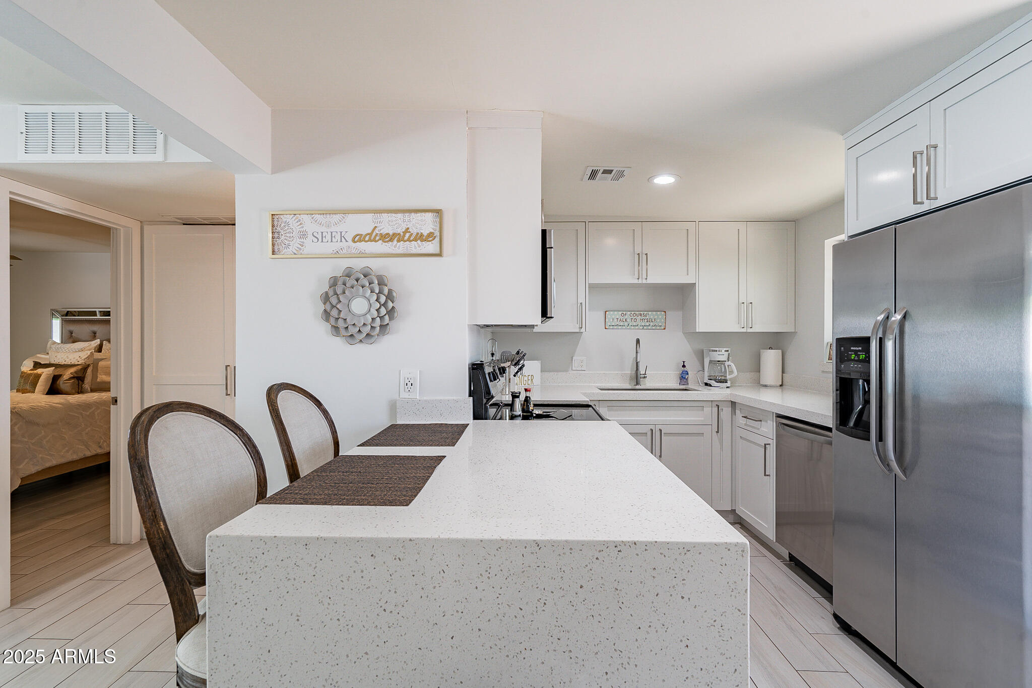 4351 North 36th Street, Unit 2 Phoenix, AZ 85018 - Photo 5 of 24 a kitchen with refrigerator cabinets and stainless steel appliances