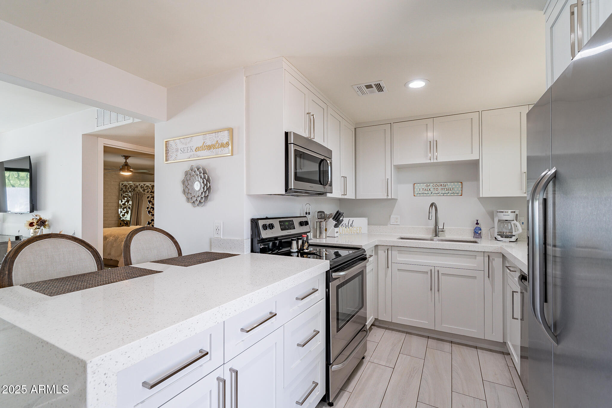 4351 North 36th Street, Unit 2 Phoenix, AZ 85018 - Photo 7 of 24 a kitchen with a sink stove and refrigerator