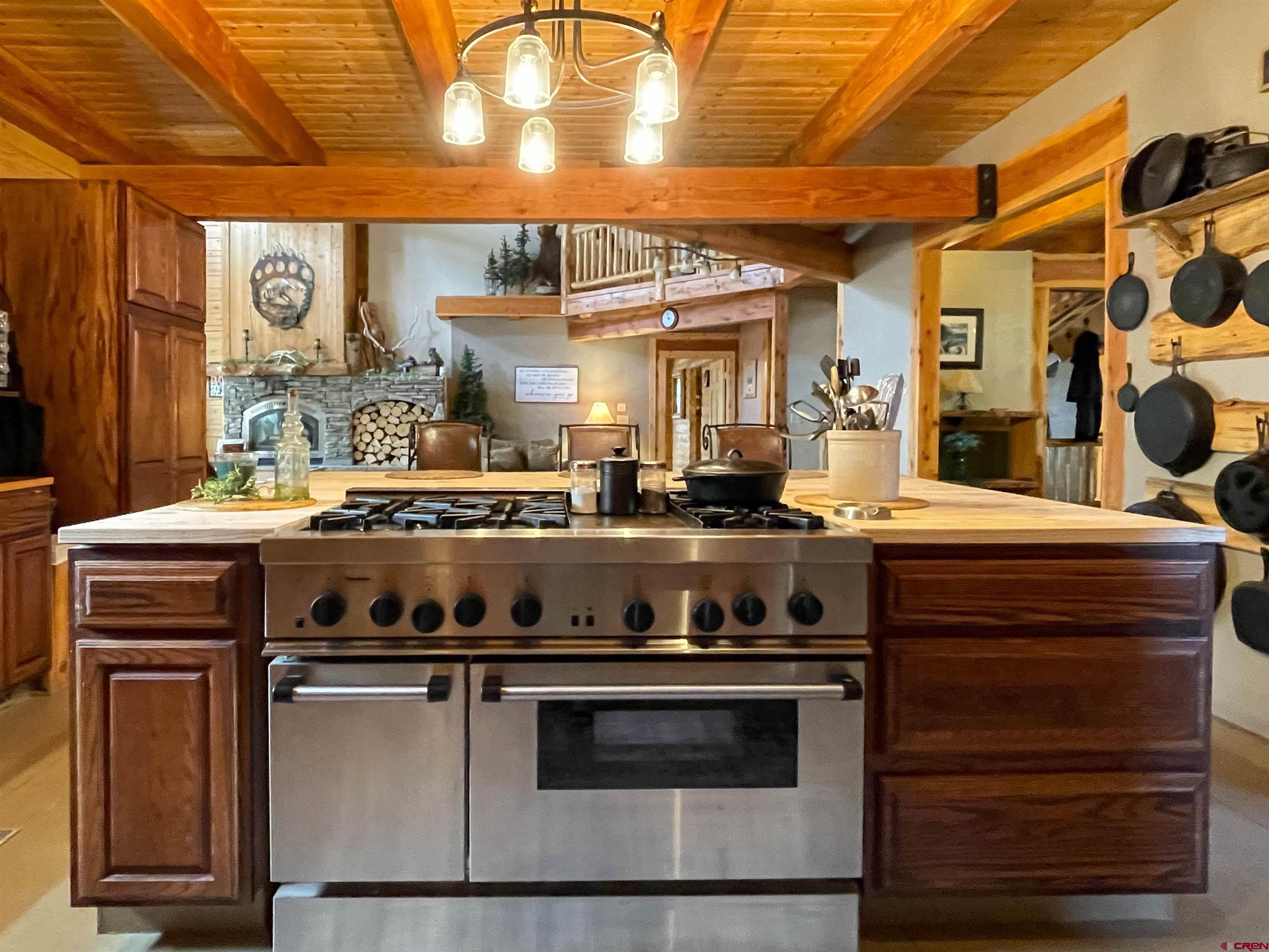 10427 2150th Road Austin, CO 81410 - Photo 12 of 35 a stove top oven sitting inside of a kitchen