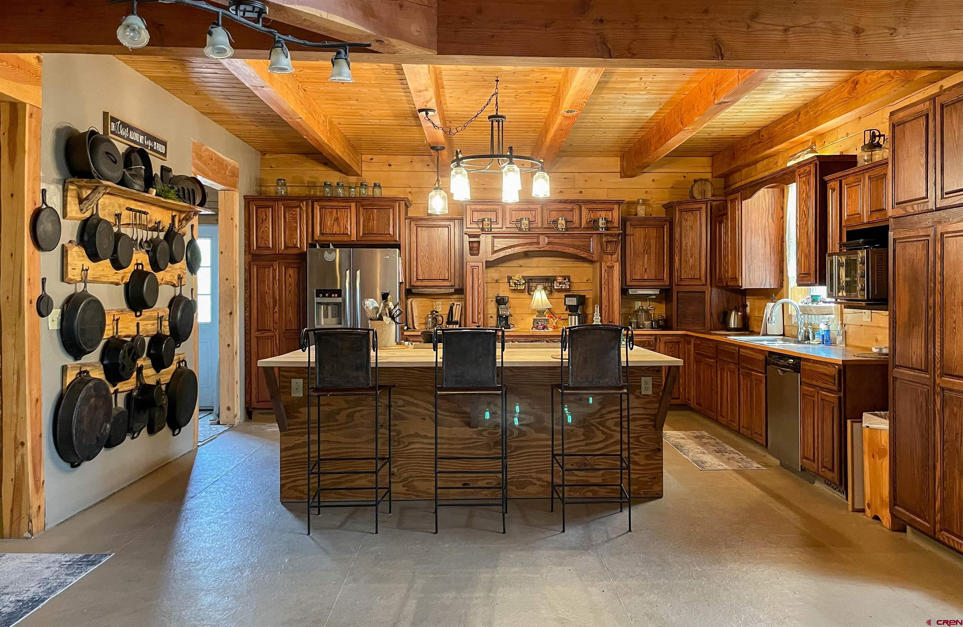 10427 2150th Road Austin, CO 81410 - Photo 13 of 35 a room with lots of wooden furniture and a shower