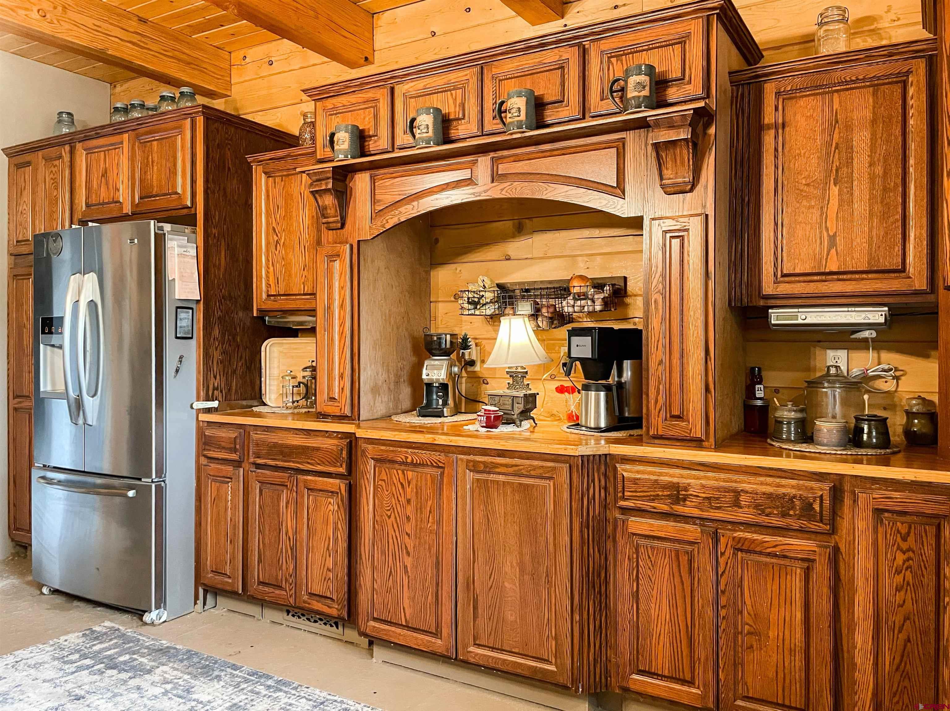 10427 2150th Road Austin, CO 81410 - Photo 16 of 35 a kitchen with stainless steel appliances granite countertop a refrigerator and cabinets