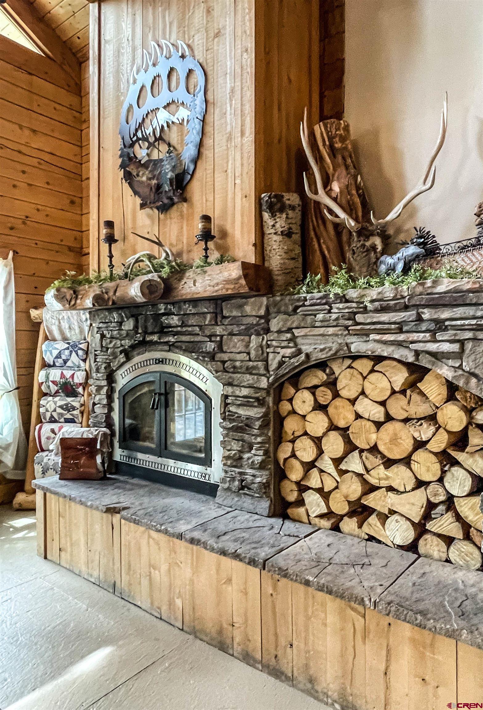 10427 2150th Road Austin, CO 81410 - Photo 8 of 35 a view of a fireplace with wooden floor