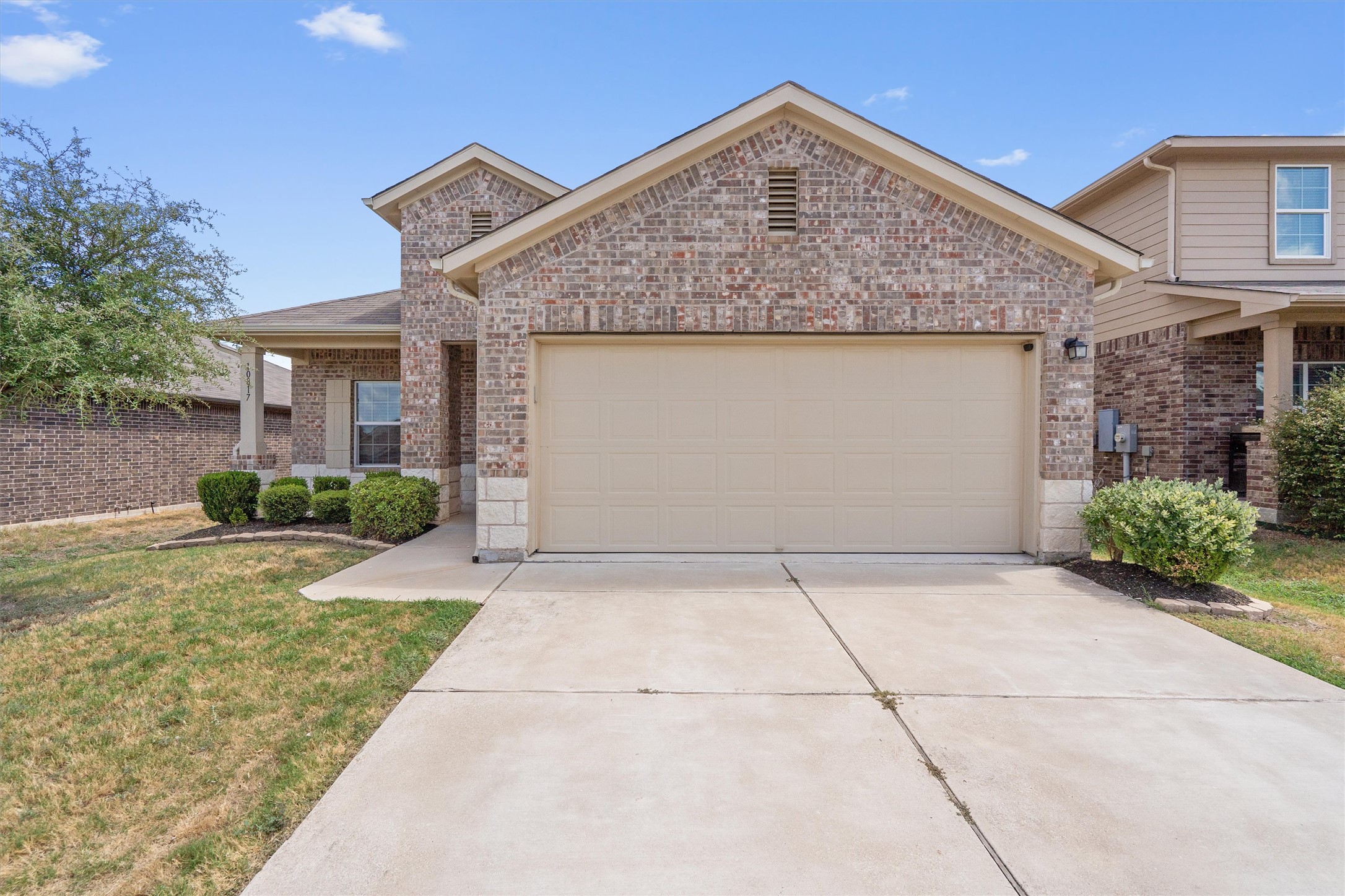 You’ve got a spacious two-car garage, low-maintenance landscaping out front, and a cozy covered entryway that makes coming home feel welcoming every day.