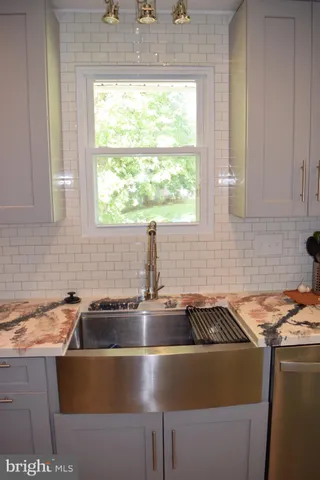 a kitchen that has a sink and a window