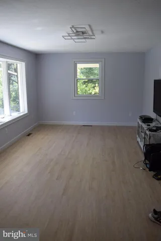 an empty room with windows
