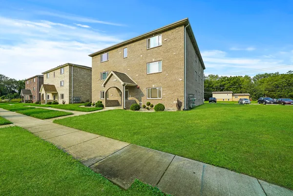 a view of a house with a big yard