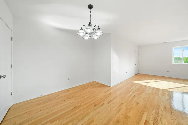 a view of a room with a ceiling fan
