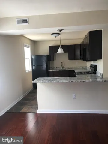 a view of a living room with a flat screen tv