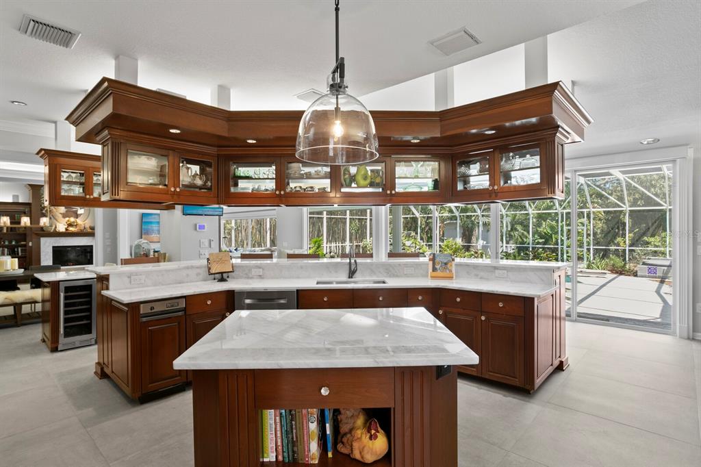 147 Edgewater Drive Dunedin, FL 34698 - Photo 17 of 99 a kitchen with a table and chairs