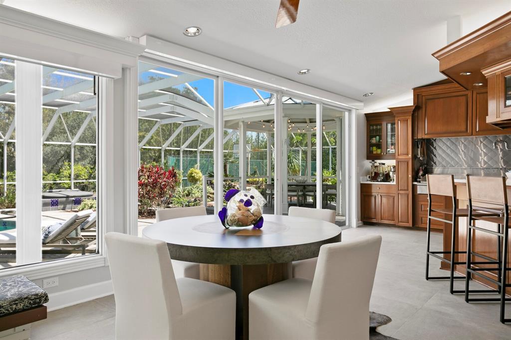 147 Edgewater Drive Dunedin, FL 34698 - Photo 18 of 99 a view of a dining room with furniture window and outside view