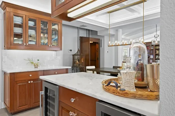 a bathroom with a sink double vanity granite tub shower and a mirror