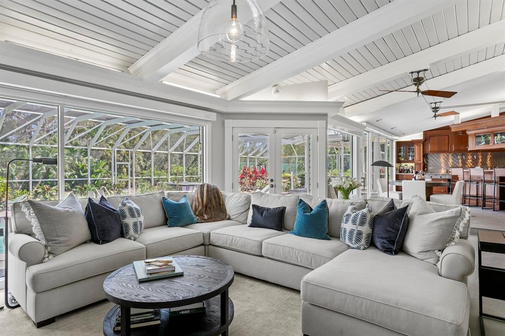 147 Edgewater Drive Dunedin, FL 34698 - Photo 23 of 99 a living room with furniture and a large window