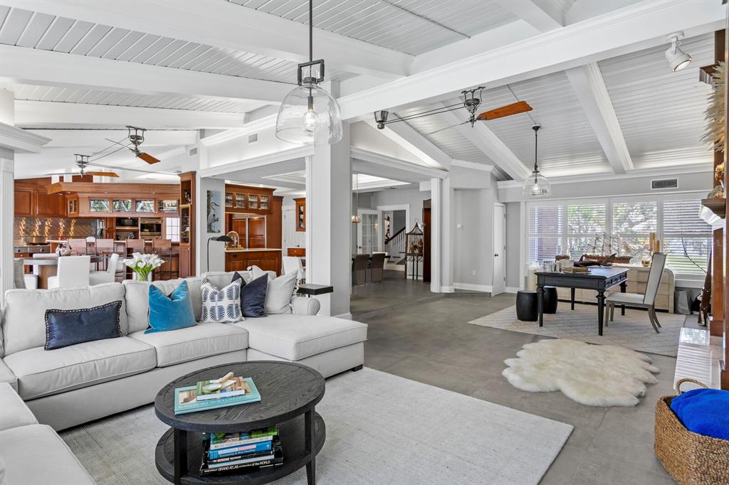 147 Edgewater Drive Dunedin, FL 34698 - Photo 24 of 99 a living room with furniture and a view of kitchen