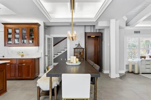 a view of a swimming pool with an outdoor space and seating area