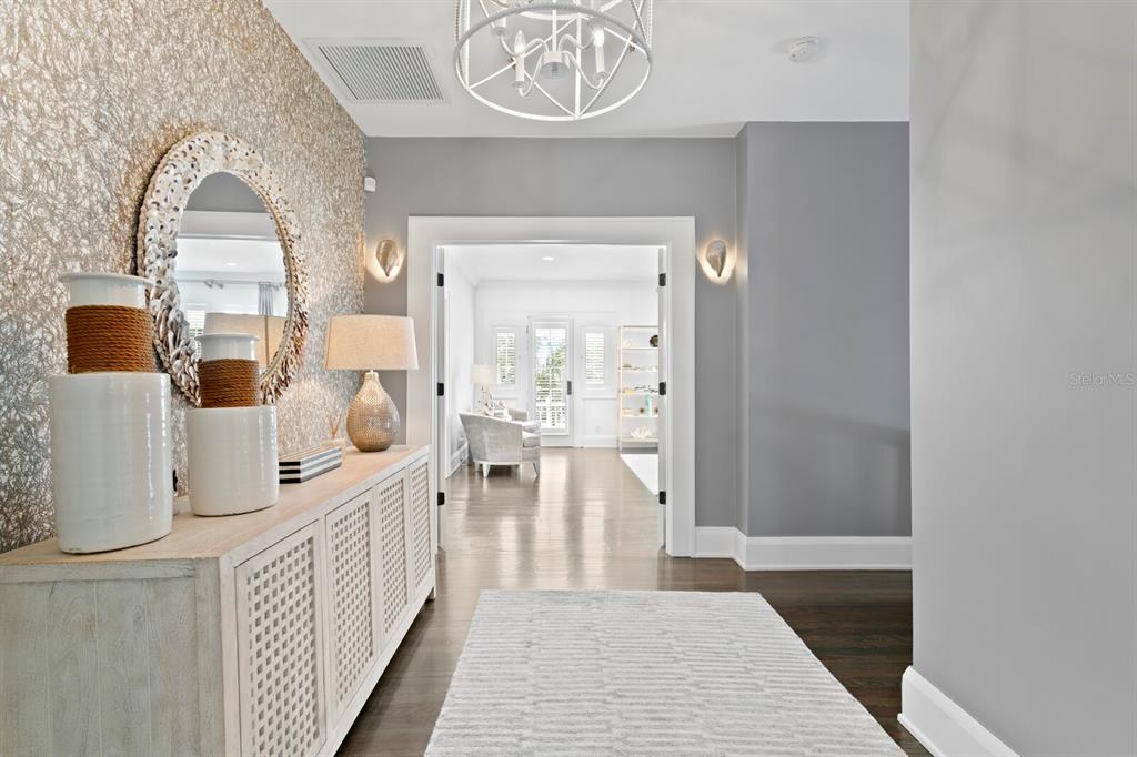147 Edgewater Drive Dunedin, FL 34698 - Photo 28 of 99 a view of living room with furniture and flat screen tv