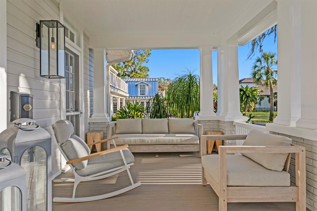 147 Edgewater Drive Dunedin, FL 34698 - Photo 3 of 99 a living room with furniture and a potted plant