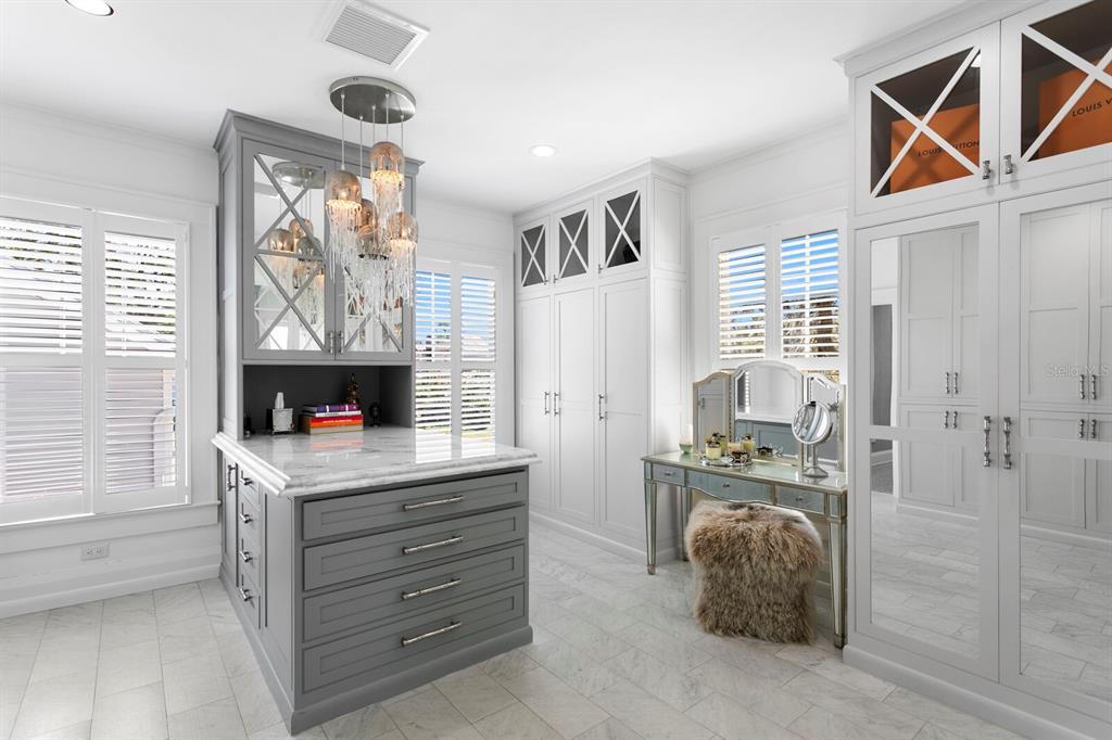 147 Edgewater Drive Dunedin, FL 34698 - Photo 32 of 99 a kitchen that has a cabinets and a stove