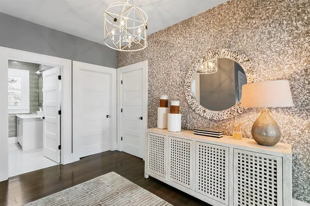 a view of a house with a yard and potted plants