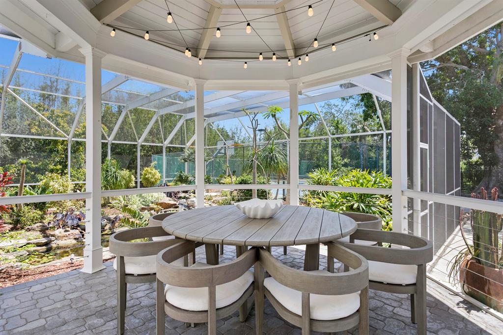 147 Edgewater Drive Dunedin, FL 34698 - Photo 43 of 99 a view of an outside dining space with furniture window and outside view