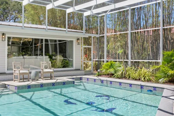 a view of a backyard with sitting area