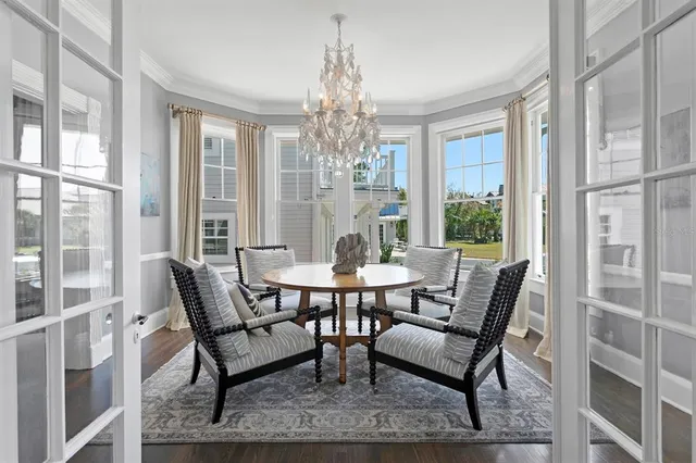 a living room with furniture a fireplace and a window