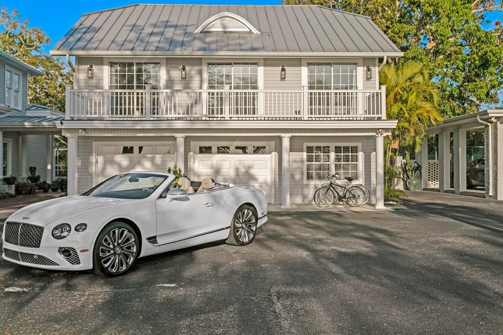 147 Edgewater Drive Dunedin, FL 34698 - Photo 83 of 99 a car parked in front of a house