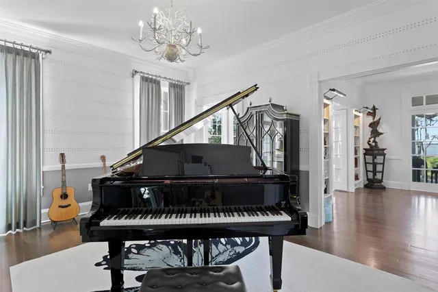 a kitchen with stainless steel appliances granite countertop a sink a stove and a wooden floors
