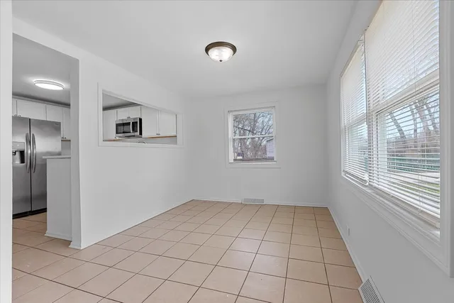 a view of an empty room and window