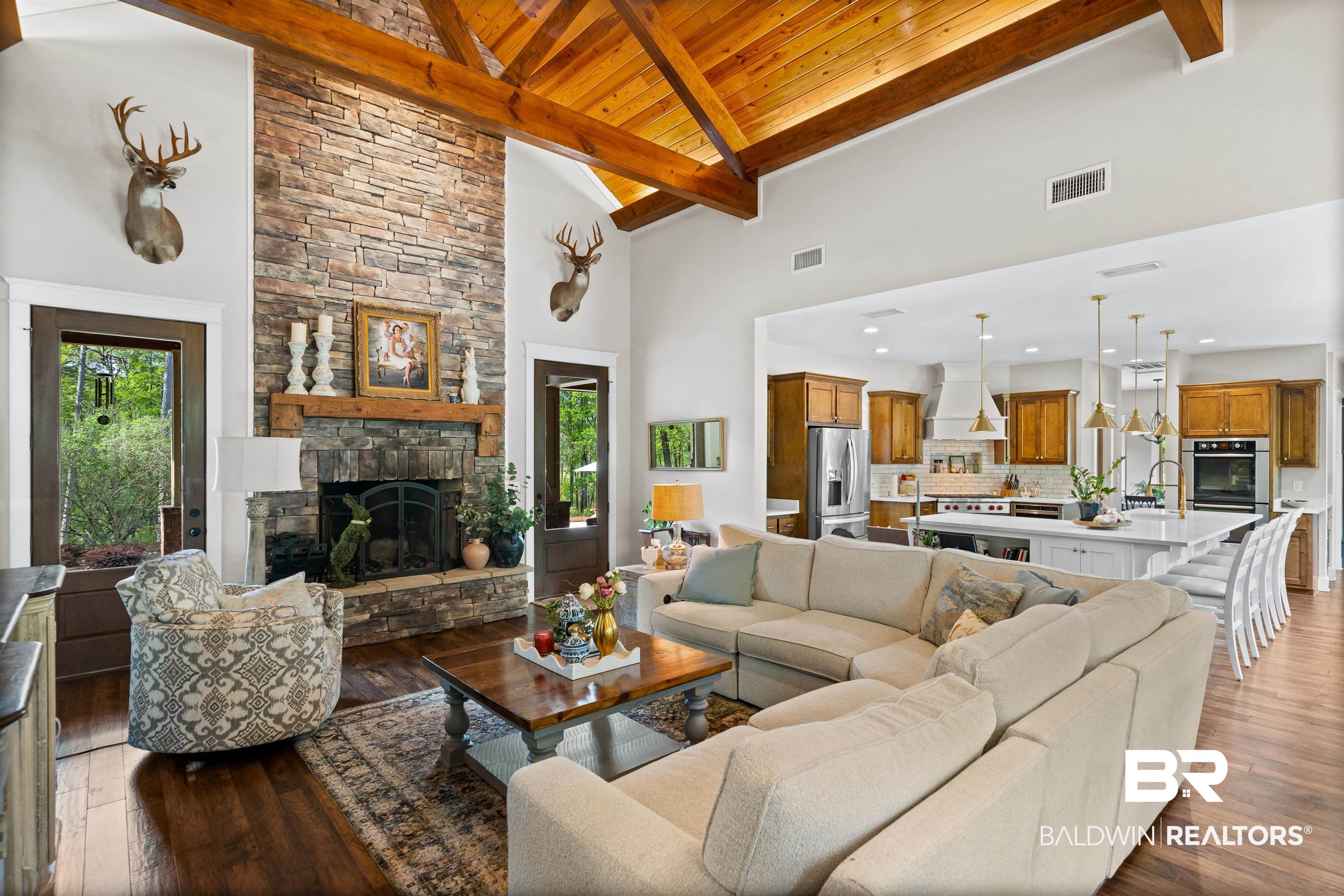 47252 Emmons Road Bay Minette, AL 36507 - Photo 11 of 50 Living room featuring dark wood finished floors, a fireplace, and a high wooden beamed ceiling