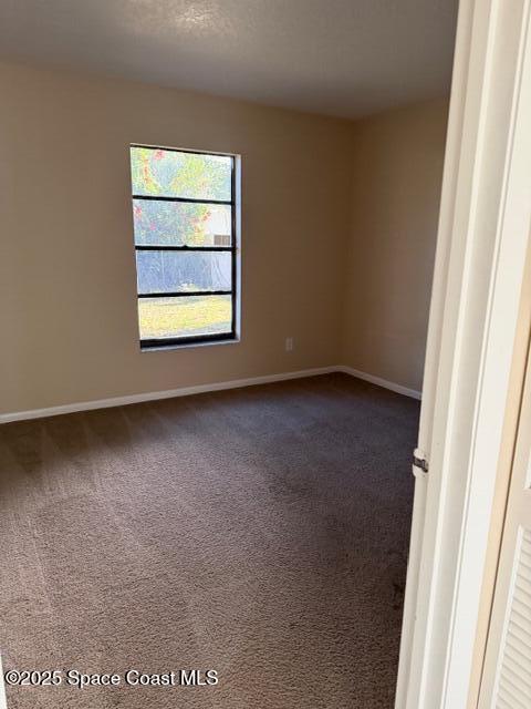 879 Remsen Avenue Northwest Palm Bay, FL 32907 - Photo 9 of 12 an empty room with a window