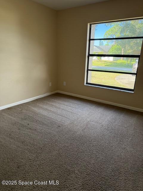 879 Remsen Avenue Northwest Palm Bay, FL 32907 - Photo 10 of 12 a view of an empty room with a window
