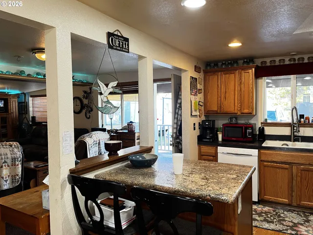 a kitchen with counter space cabinets and appliances