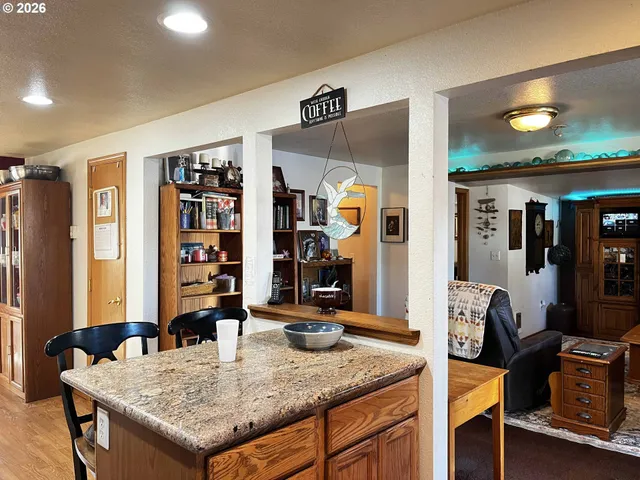 a kitchen that has a table and chairs in it