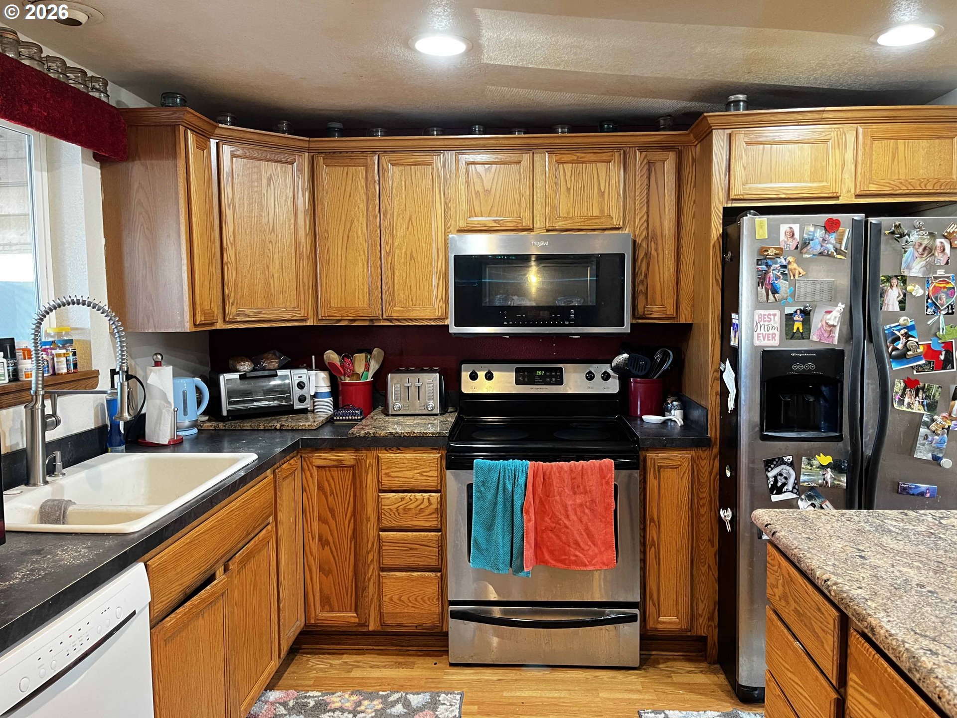 1890 37th Street Florence, OR 97439 - Photo 17 of 41 a kitchen with stainless steel appliances kitchen island granite countertop a sink and a stove