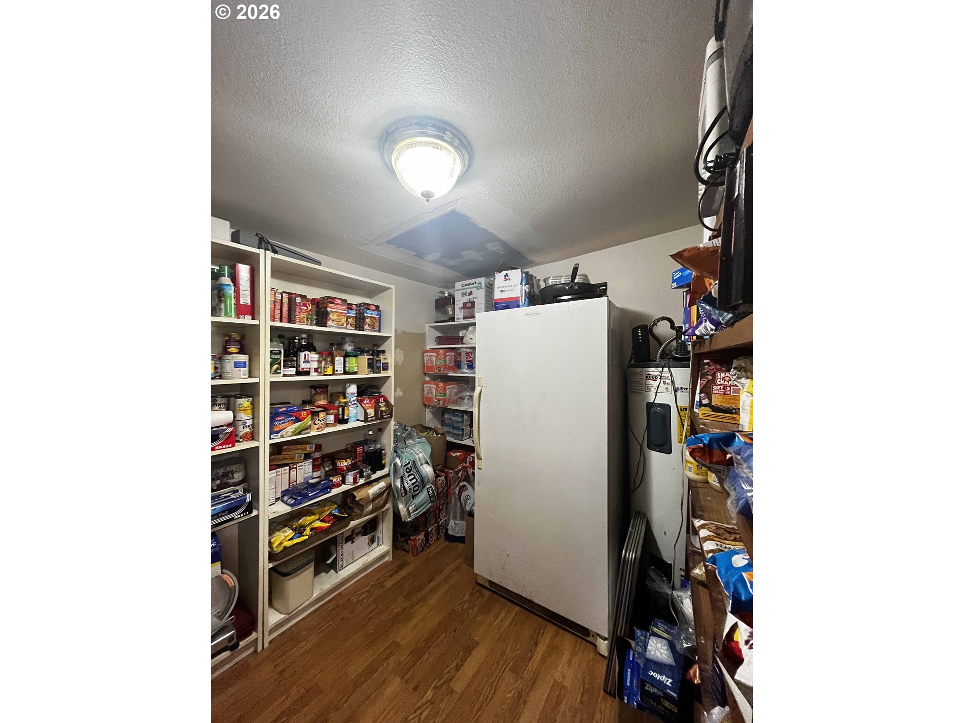 1890 37th Street Florence, OR 97439 - Photo 20 of 41 a room with bookshelf and wooden floor